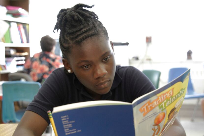R'reanna Wooten, 11, reads in her fourth grade writing class at George W. Carver Creative...