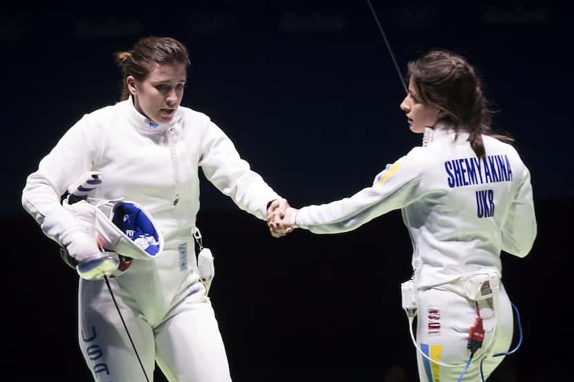Courtney Hurley of the USA shakes the hand of her opponent, Yana Shemyakina of Ukraine,...