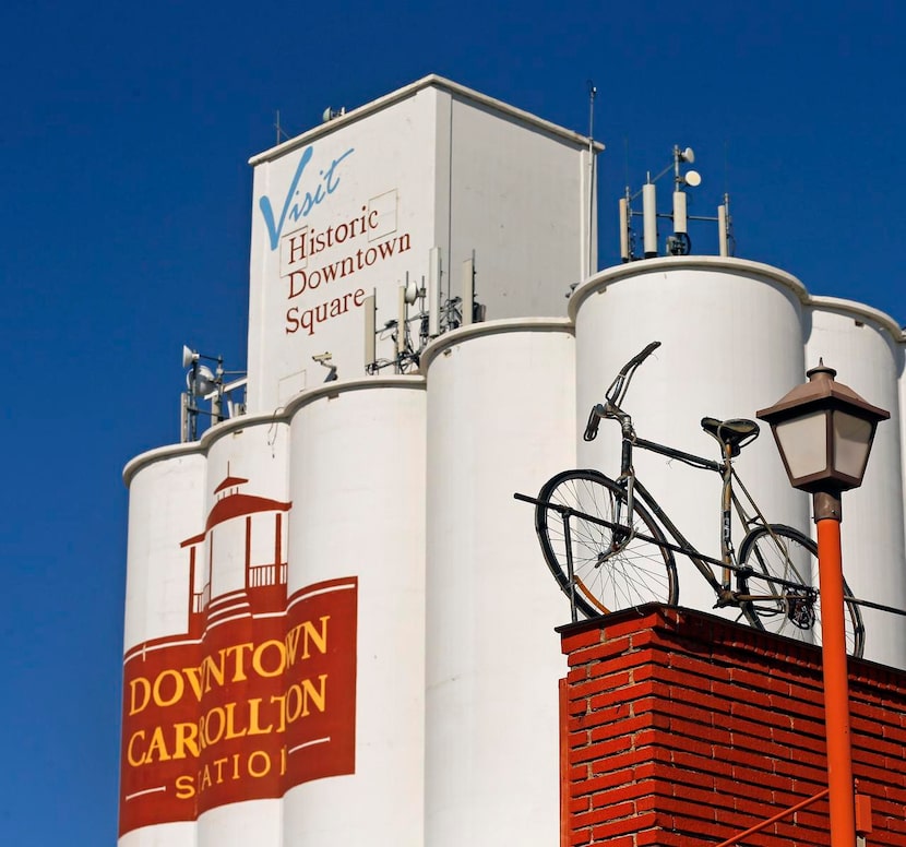 
An old bicycle sits atop the now-closed Bicycle Exchange shop on South Broadway Street in...