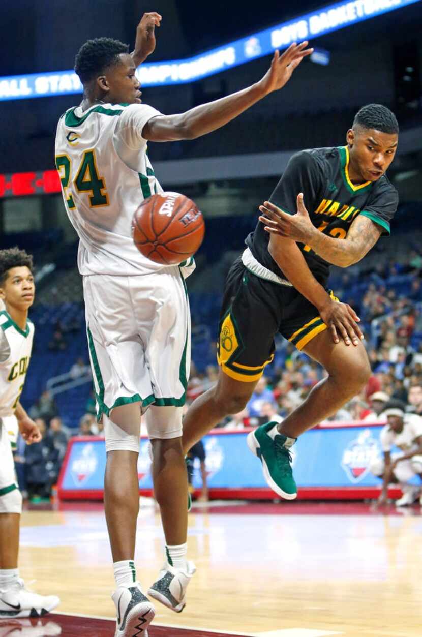 Madison's Jerome Henry #11 passes off after driving past San Antonio Cole's Vincent...