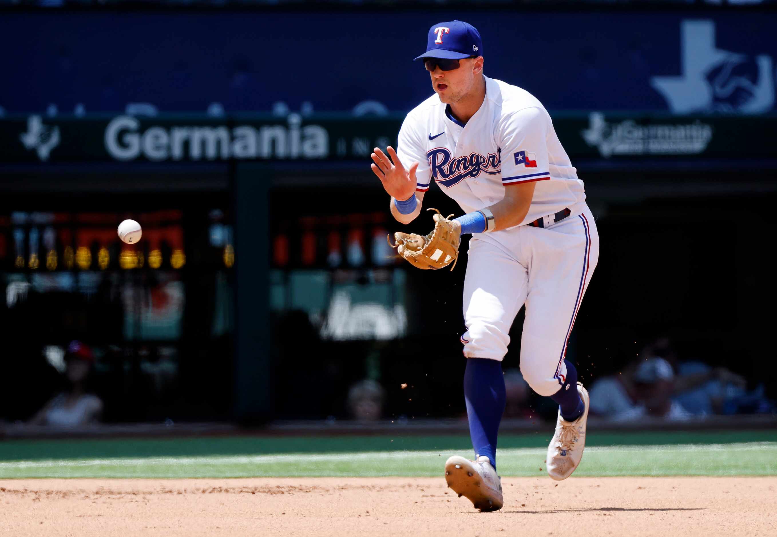 Texas Rangers third baseman Josh Jung (6) fields a grounder and throws out Arizona...