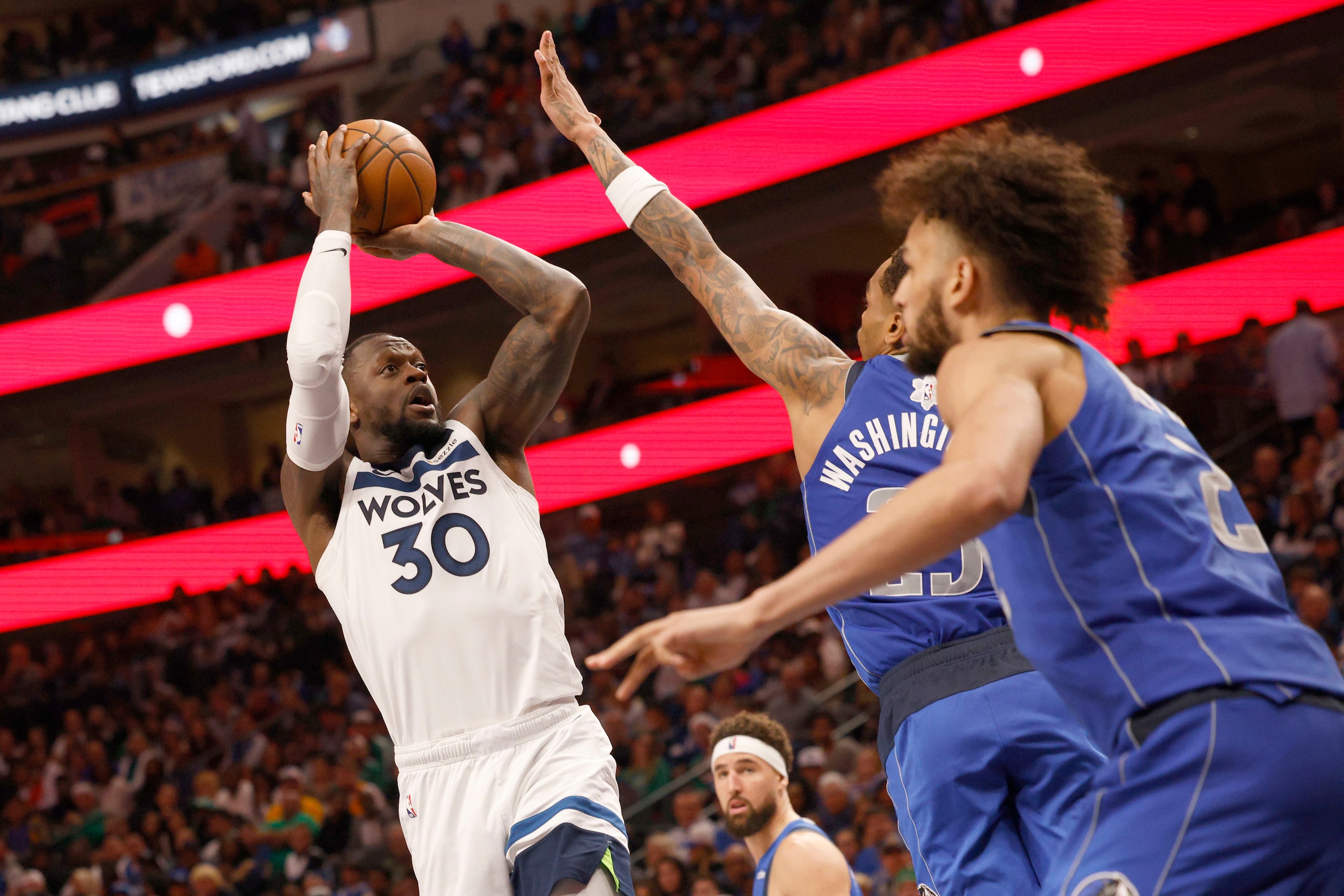 Minnesota Timberwolves forward Julius Randle (30) shoots over Dallas Mavericks forward P.J....