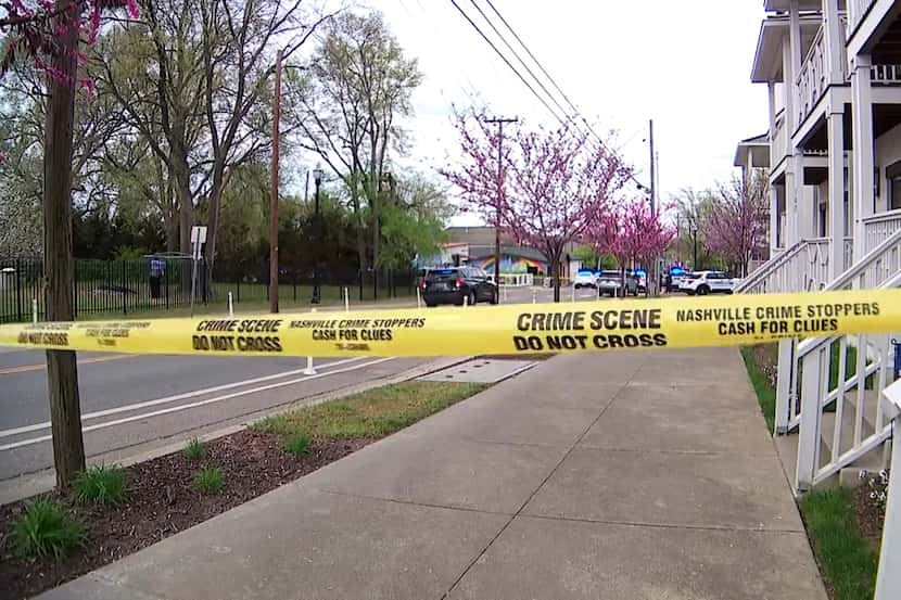 This image made from video shows the crime scene tape across street after a fatal shooting...