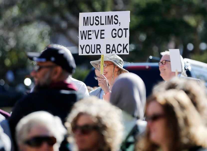 A woman holds up a sign during a Texas Muslim Capitol Day rally in Austin on Tuesday,...