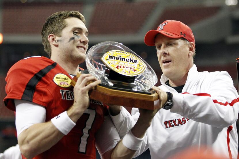 Texas Tech Red Raiders quarterback Seth Doege (7) and Texas Tech Red Raiders interim head...