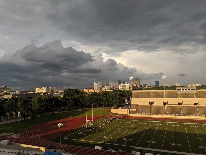 A brief moment of sunshine as storm clouds loom over the city prior to the Chisholm Trail...