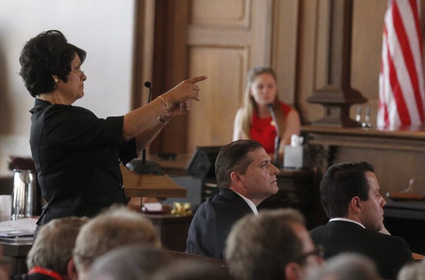 Prosecutor Sarah R. Saldana, defense attorney Toby Shook , center, and Cameron Cox (Lee...