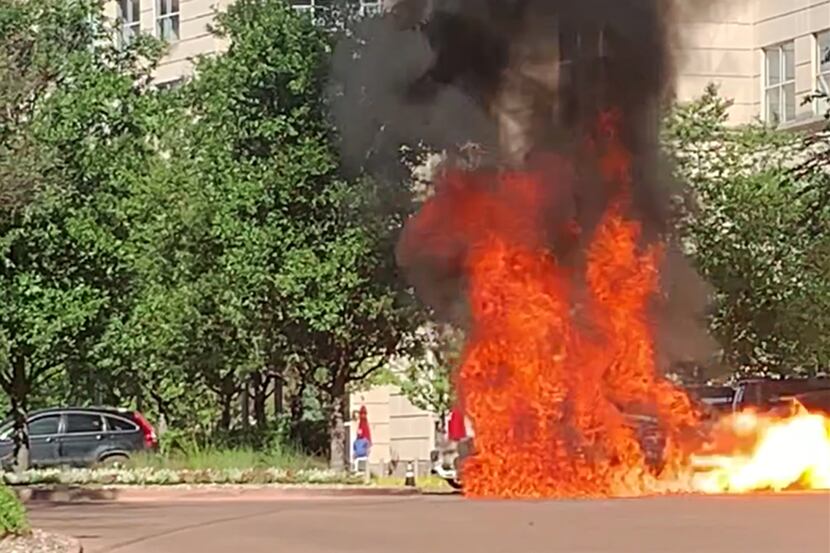 A car caught fire and exploded outside the Crescent complex Thursday in Uptown Dallas.