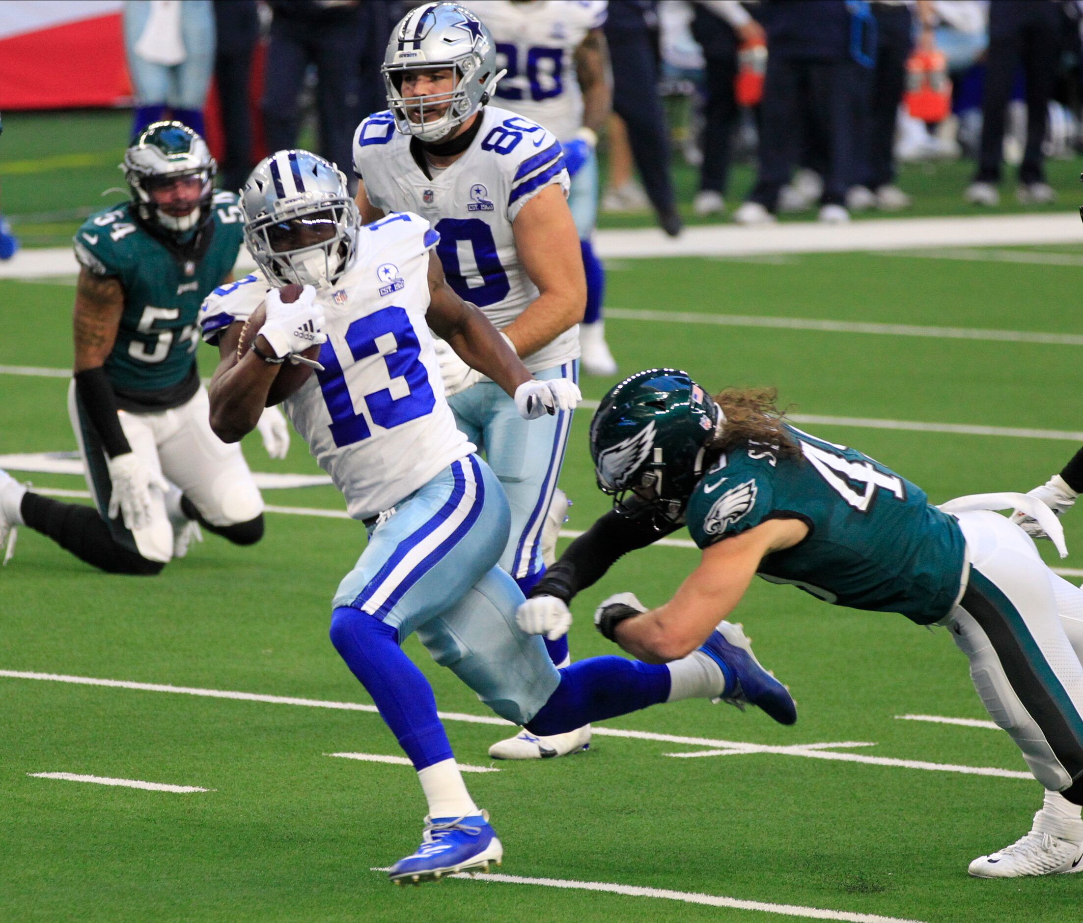 Dallas Cowboys wide receiver Michael Gallup (13) picks his way into the end zone for a...