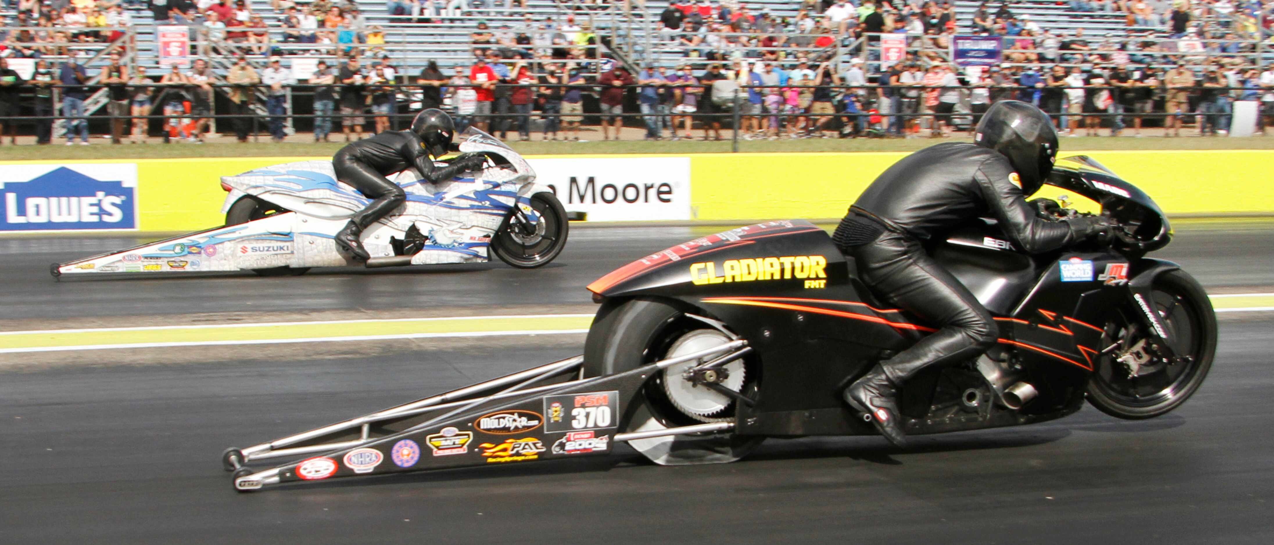M. Ingwersen (foreground) races J. Savoie in the Pro Stock Motorcycle preliminaries. The...