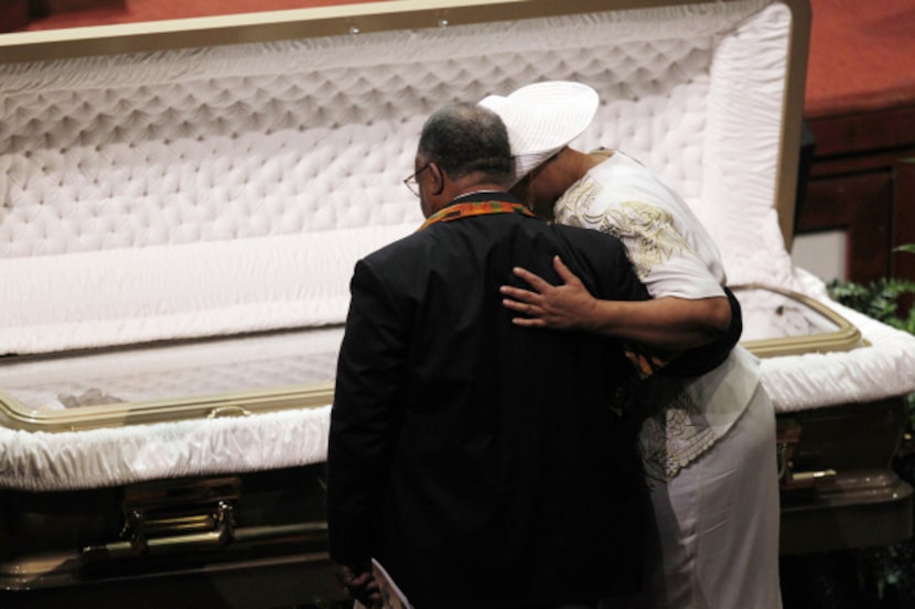 Family members bid farewell to Al Lipscomb at Saturday's ceremony.