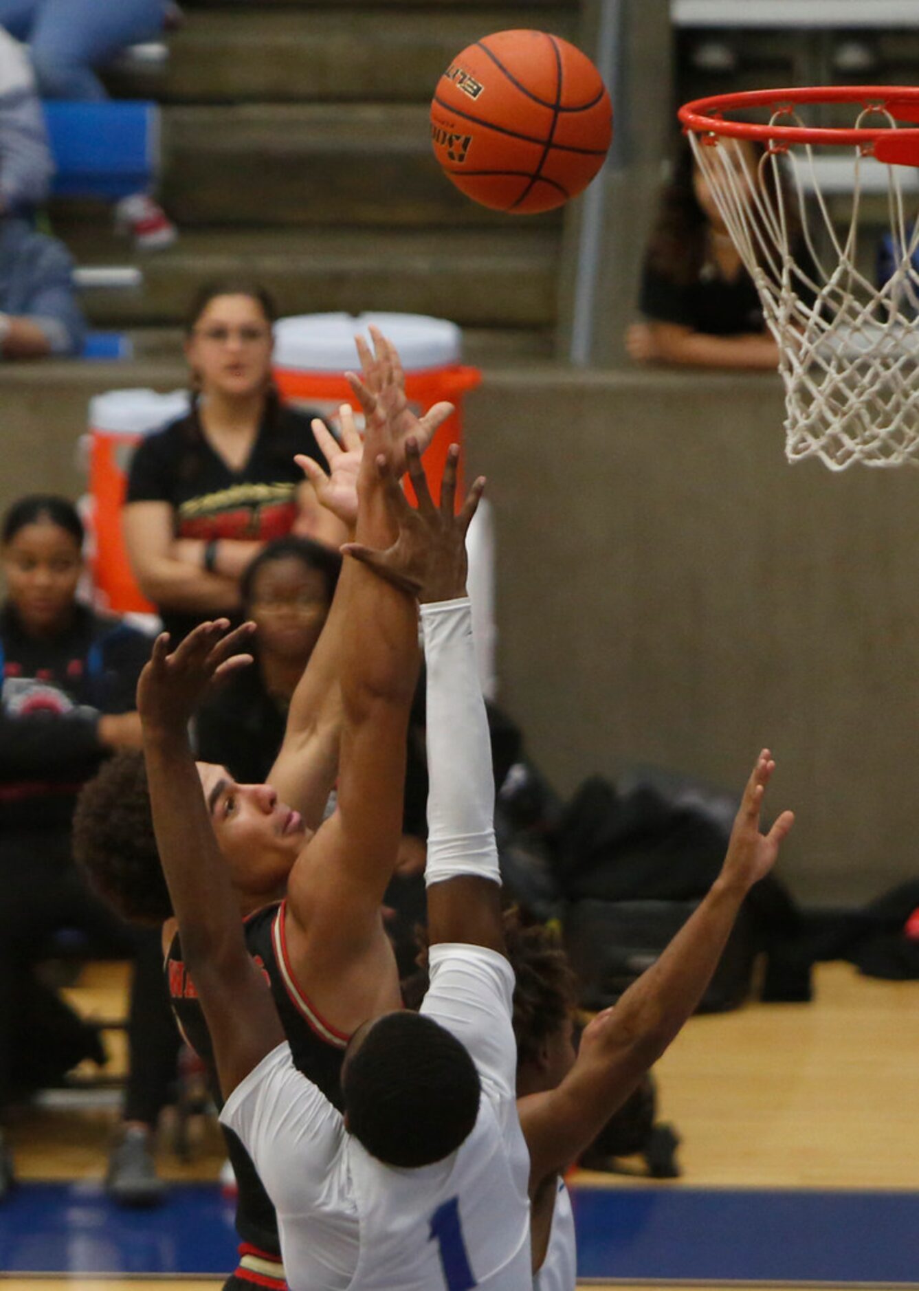 South Grand Prairie's Anthony Solomon (1) shoots against the defense of Grand Prairie's...