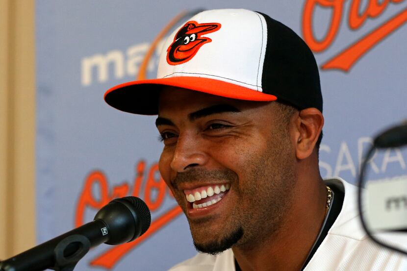 Baltimore Orioles' Nelson Cruz smiles as he is introduced to the media during a news...