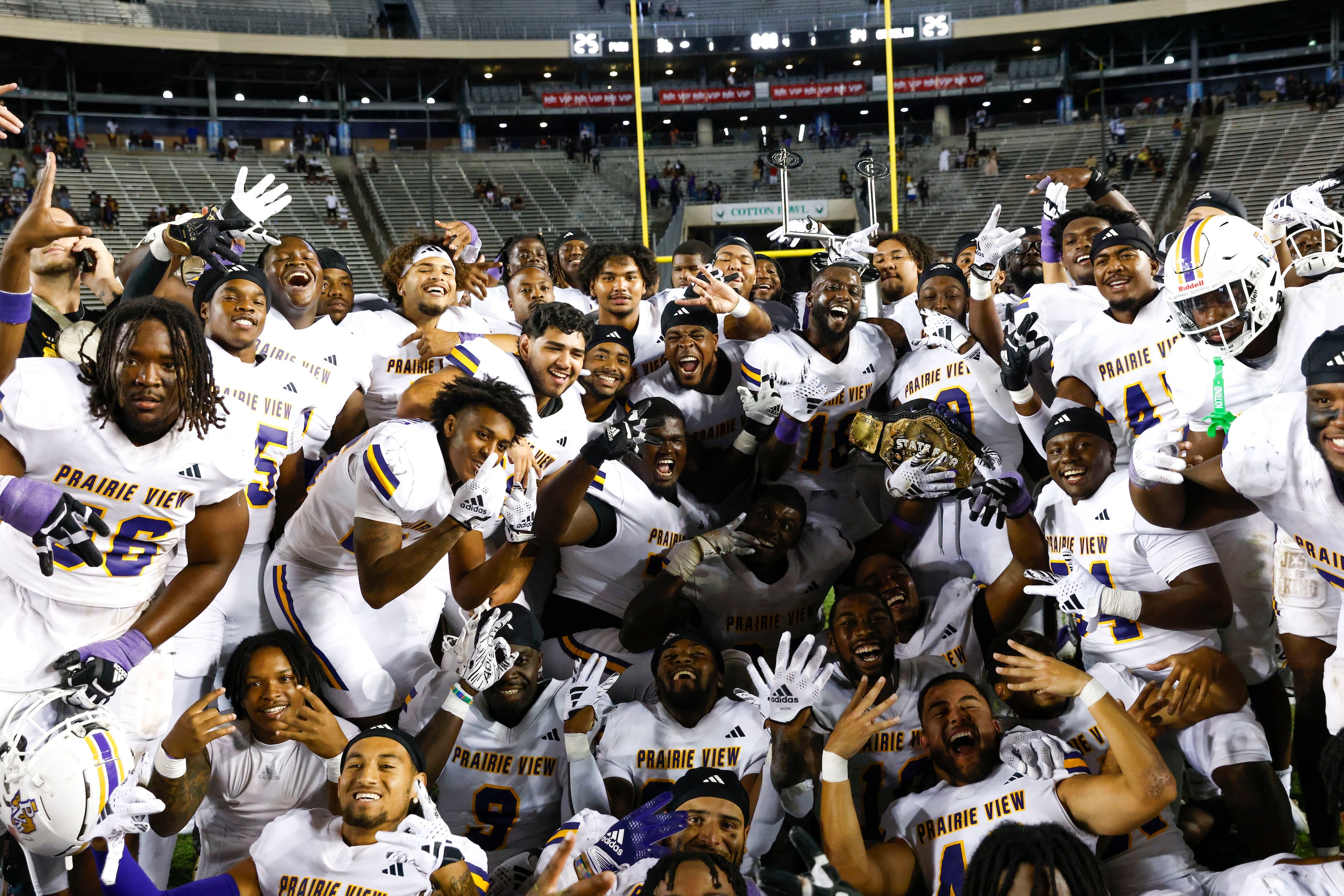 Prairie View A&M players celebrate after winning the State Fair Classic against Grambling...