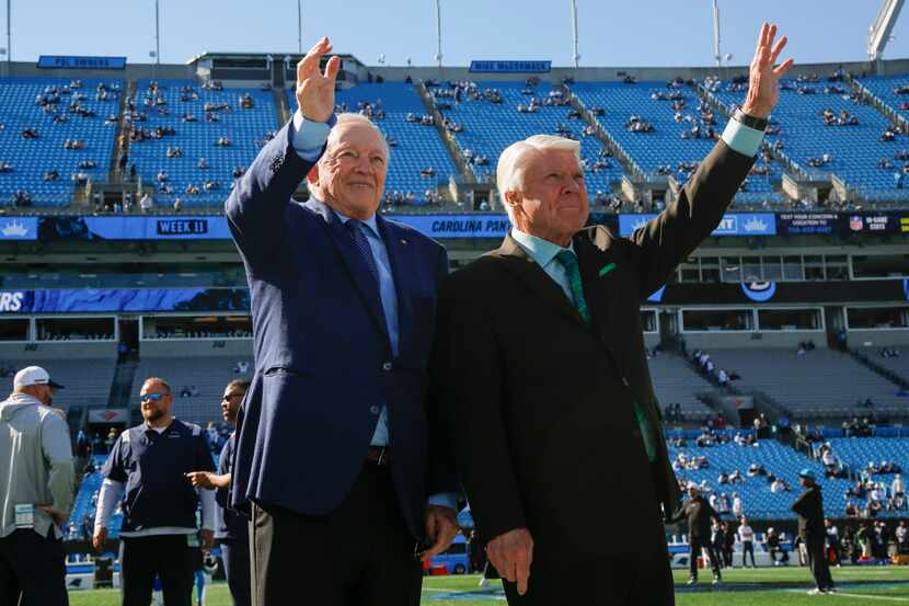 Dallas Cowboys owner Jerry Jones chats with Pro Football Hall of Fame coach Jimmy Johnson...