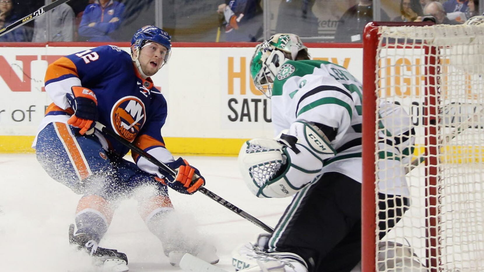 NEW YORK, NY - JANUARY 03: Josh Bailey #12 of the New York Islanders is stopped by Kari...
