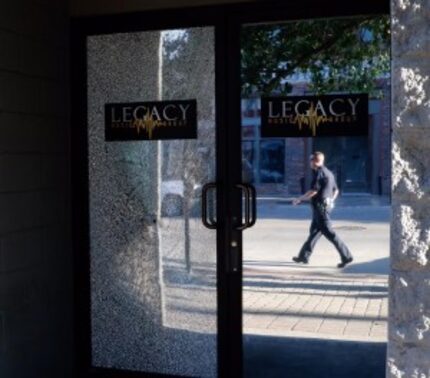  A bullet shattered the glass door at the Legacy Studios. (David Woo/Staff Photographer)