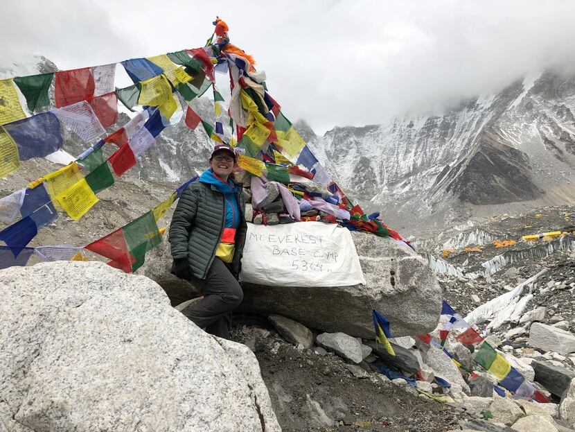 Writer Molly Sprayregen beams after reaching Everest Base Camp, which rests on a massive...