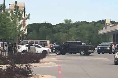 Law enforcement agencies gather outside Buc-ee's in Denton after an officer-involved...