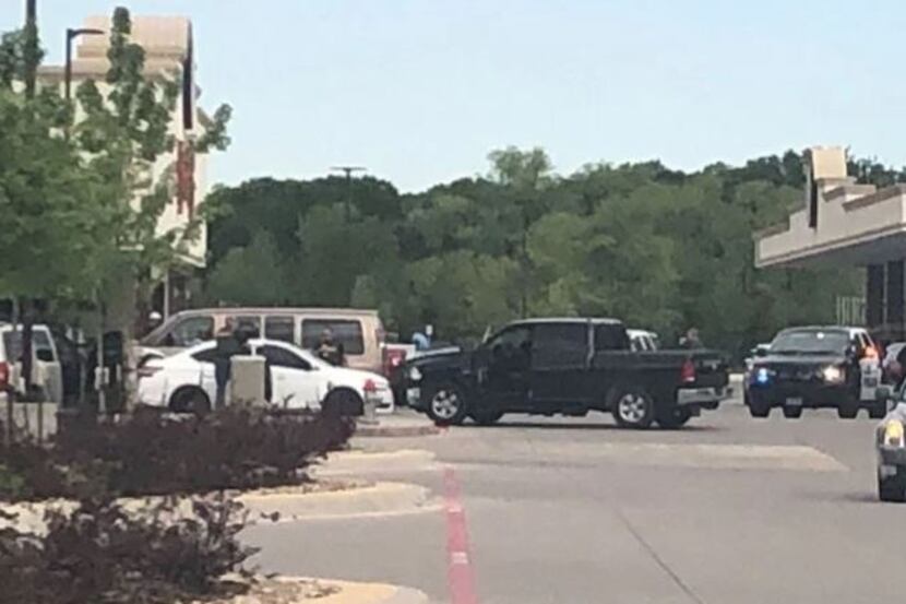 Law enforcement agencies gather outside Buc-ee's in Denton after an officer-involved...
