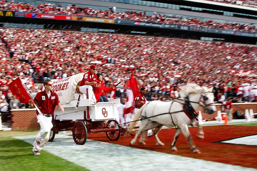 Flanked by Ruf Neks, the Boomer Schooner wagon is pulled by ponies Boomer and Sooner (one is...