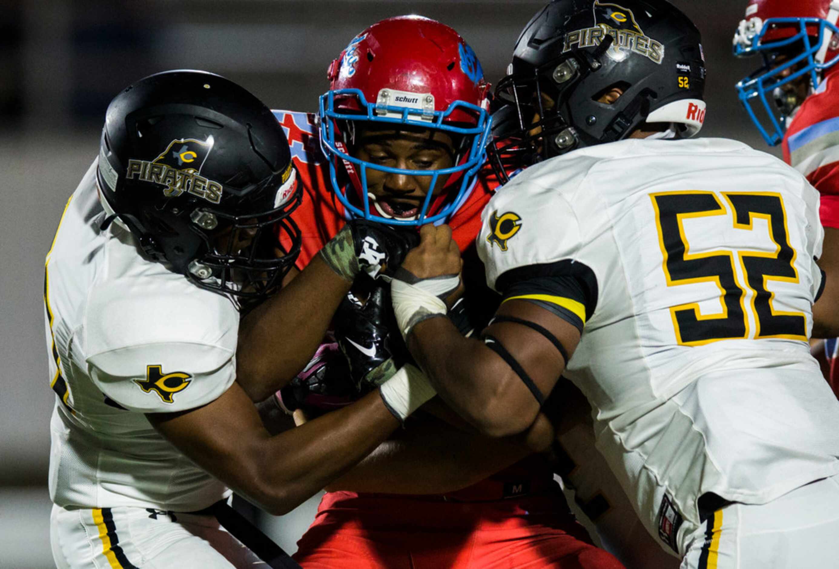 Carter running back Jamalrian Jones (23) is tackled by Crandall defensive end Tommy Crockett...