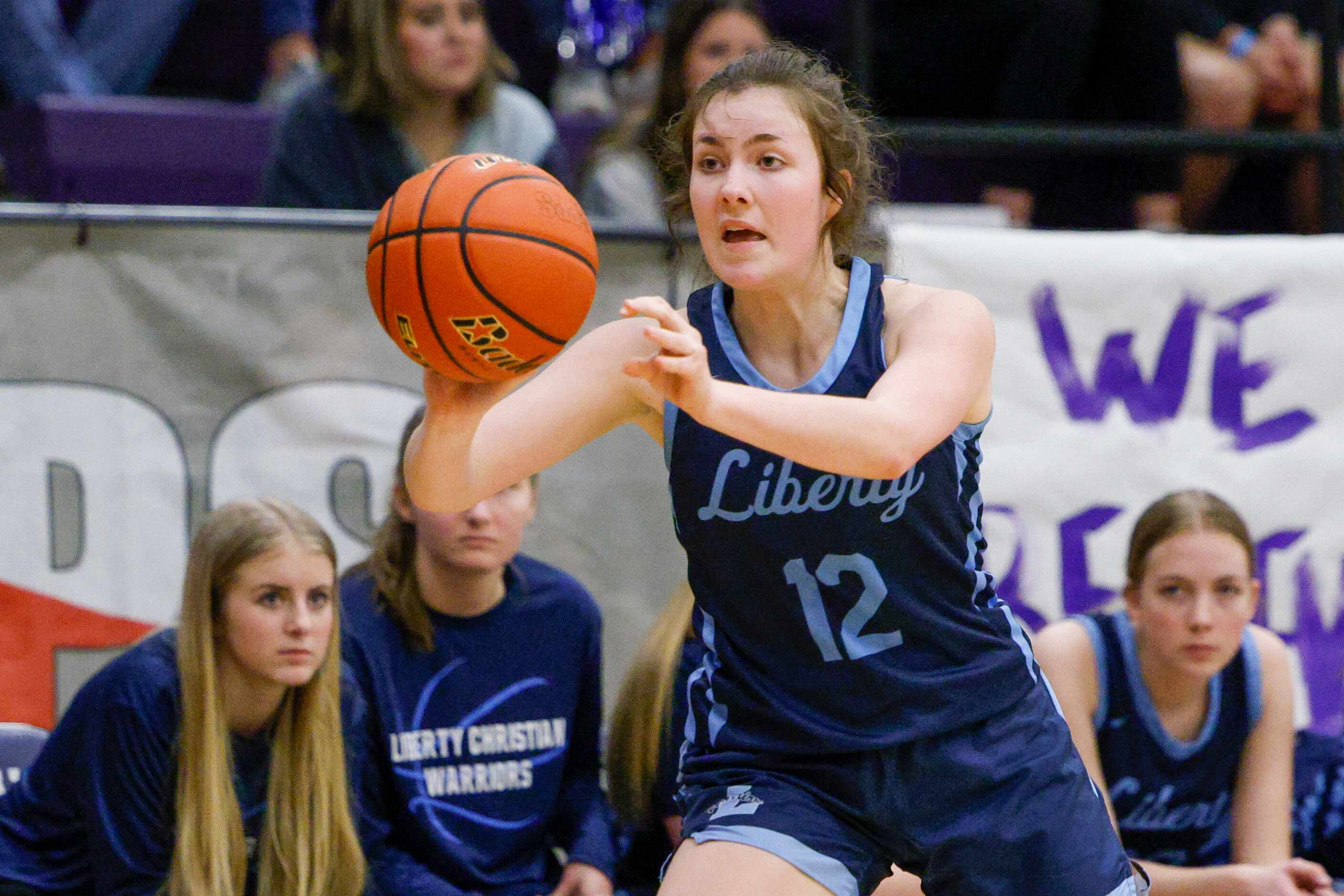 Argyle Liberty Christian guard Elizabeth Egger (12) passes the ball during the second half...