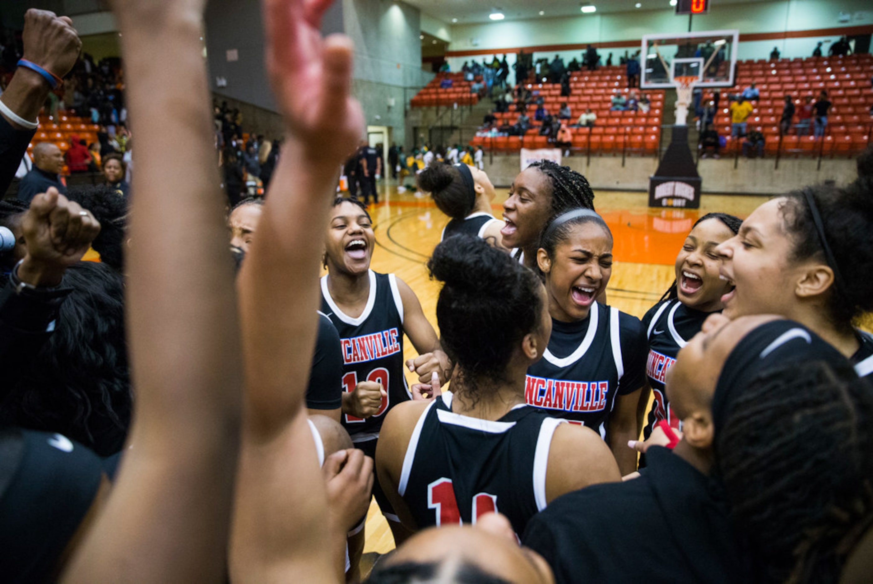 Duncanville celebrates a 47-43 win after a Class 6A Region I quarterfinal girls basketball...