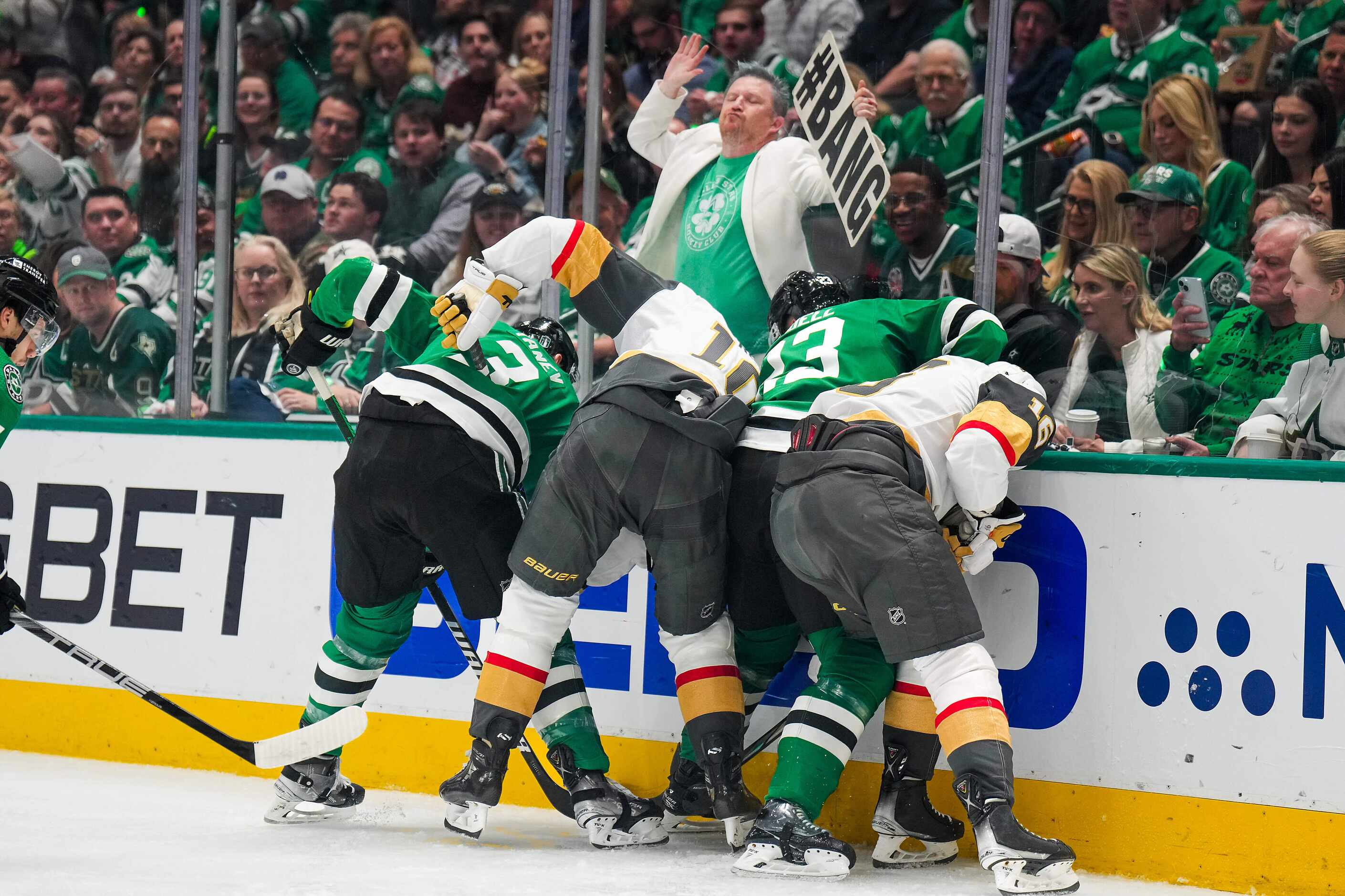 Dallas Stars defenseman Chris Tanev (3) and center Sam Steel (13) fight for the puck against...