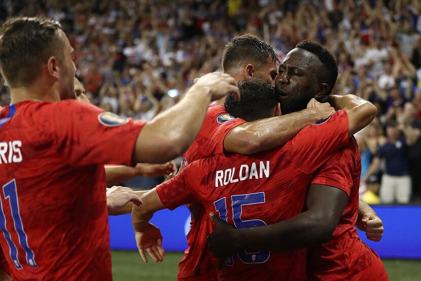 KANSAS CITY, KANSAS - JUNE 26:  Jozy Altidore #17 of the United States is congratulated by...
