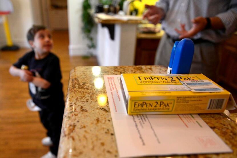 
Epinephrine pens sit at the ready in the Mathis home in North Dallas. So far, son Ben has...