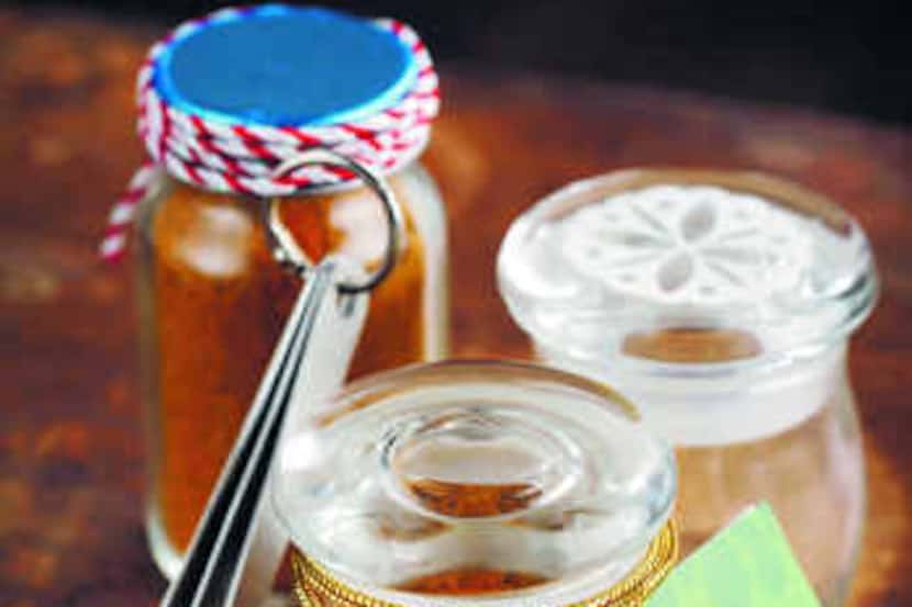  Use scraps of ribbon and twine to embellish bottles of Homemade Curry Powder. Attach a set...