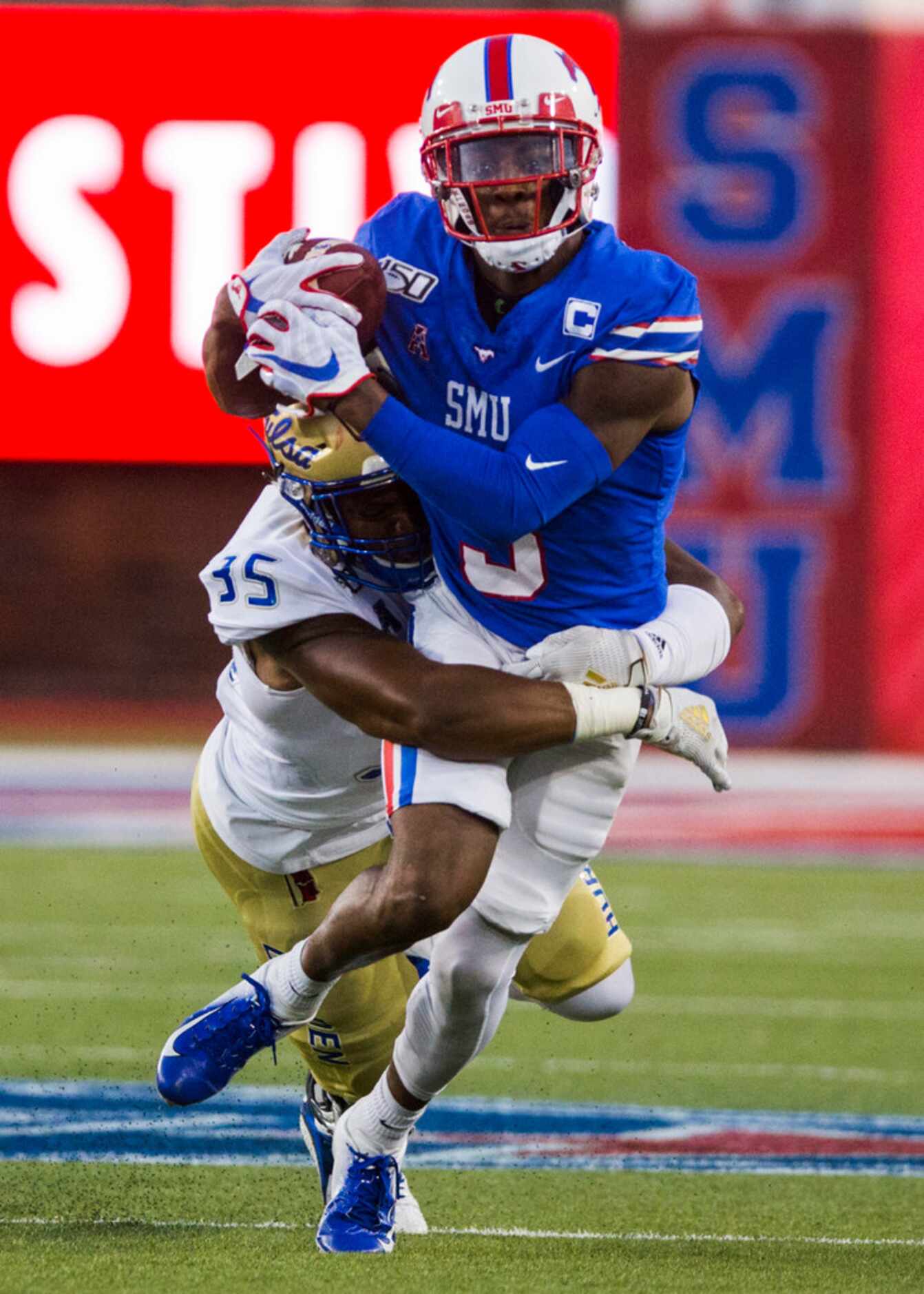 SMU Mustangs quarterback William Brown (9) is tackled by Tulsa Golden Hurricane linebacker...