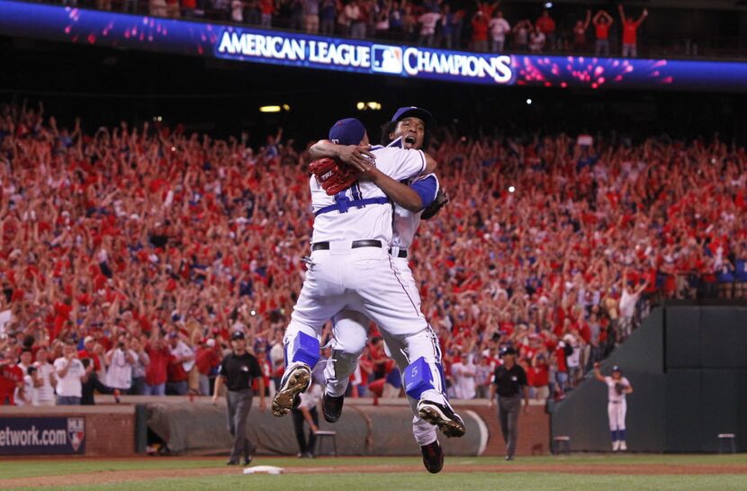 Texas Rangers catcher Bengie Molina and pitcher Neftali Feliz celebrate beating the New York...