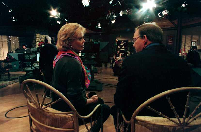 Dotty Griffith talks with Gary Cogill on the set of Good Morning Texas in 1999.