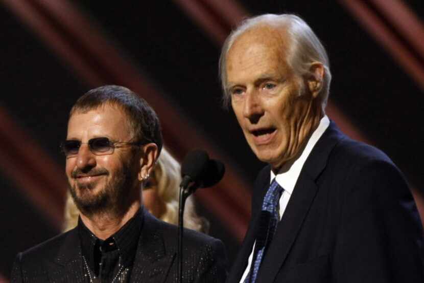 Former Beatles member Ringo Starr and producer George Martin give an acceptance speech after...