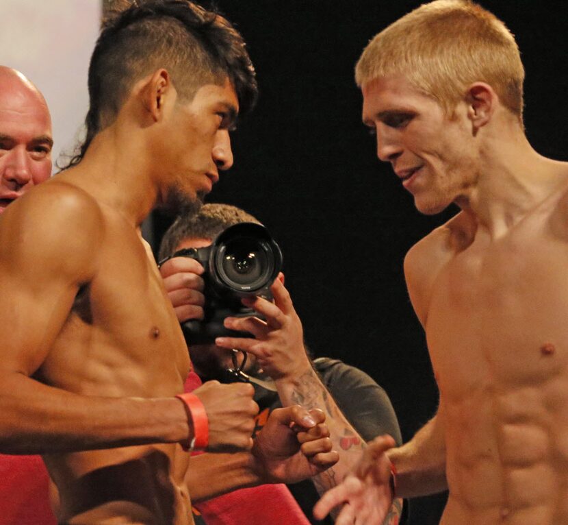 Will Campuzano poses with opponent Justin Scoggins during UFC weigh-ins at Gilley's in...