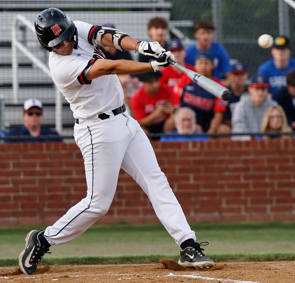 Arlington Martin's Romel Garcia hits a single during the first inning of a baseball game...