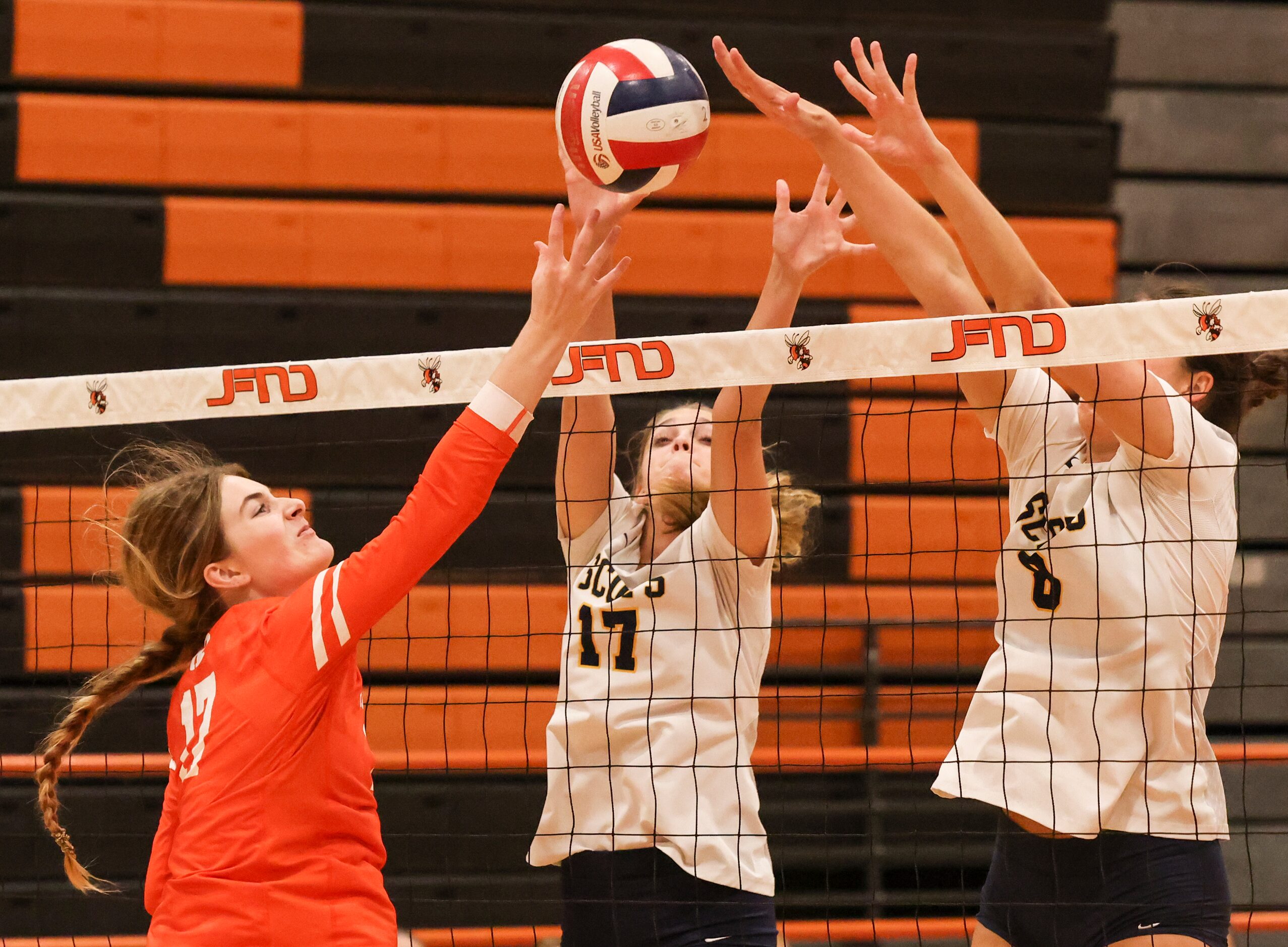 Rockwall High School’s Sydney Lafferty spikes the ball over the net as Highland Park’s Alex...