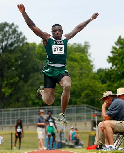 Waxahachie long jumper Jalen Reagor competes in the preliminary round of the 5A Region II...