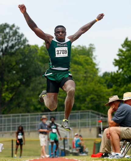 Waxahachie long jumper Jalen Reagor competes in the preliminary round of the 5A Region II...