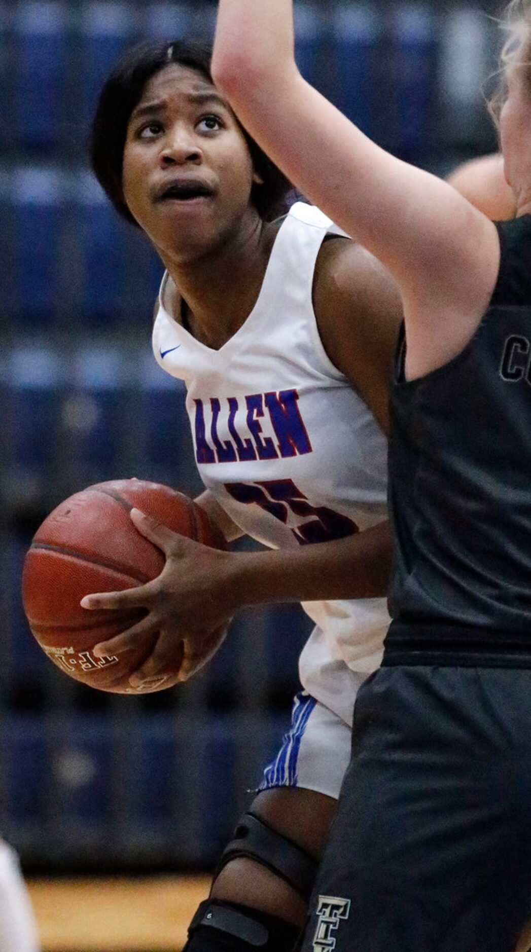 Allen High School Jamaya Johnson (25) looks for the basket during the first half as Allen...