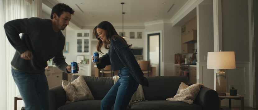 Miles Teller and his wife in Bud Light's Super Bowl spot.