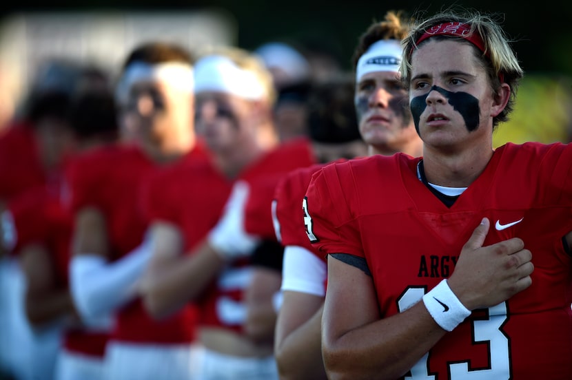 Argyle junior quarterback Bo Hogeboom (13) stands for the national anthem before the start...