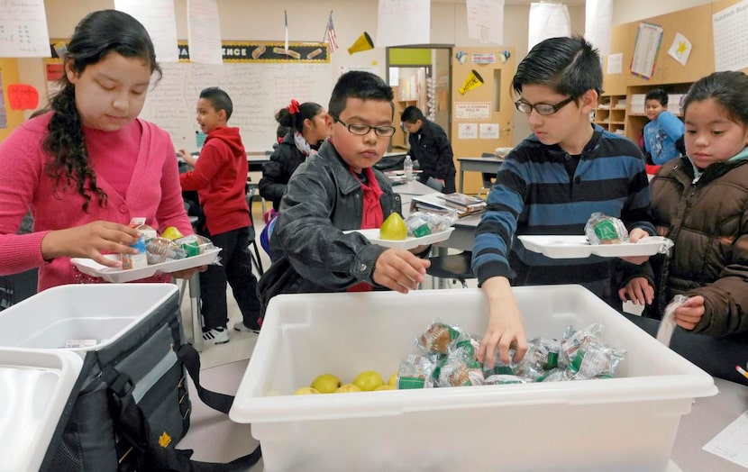 
Metzly Avila (from left), 9, Jesse De La Cruz, 10, Gildardo Estrada, 9, and Maribel Gloria,...