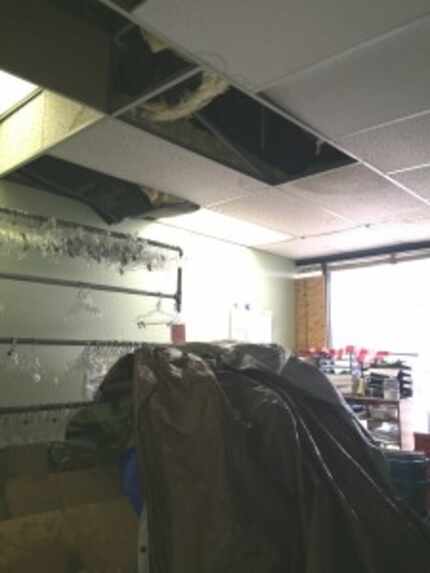  Water fell through the ceiling tiles during a hail storm last week in the back of the sales...