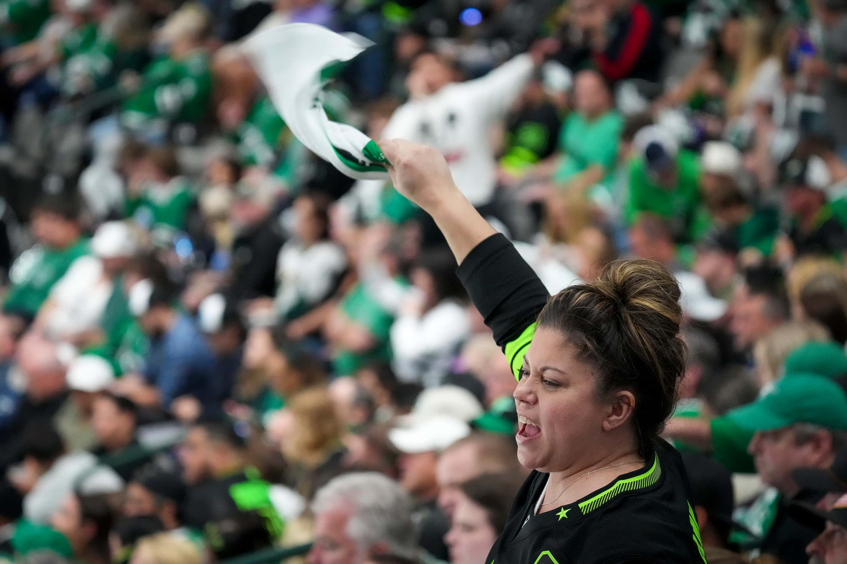 Dallas Stars fans cheer their team during the first period in Game 6 of the Stanley Cup...