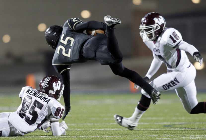 South Oak Cliff running back Dejon Johnson (25) is upended by Wylie defensive back Ben...