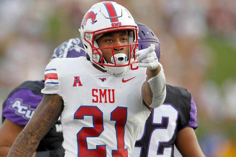 SMU receiver Reggie Roberson, Jr, (21) gestures after making a reception for a first down...