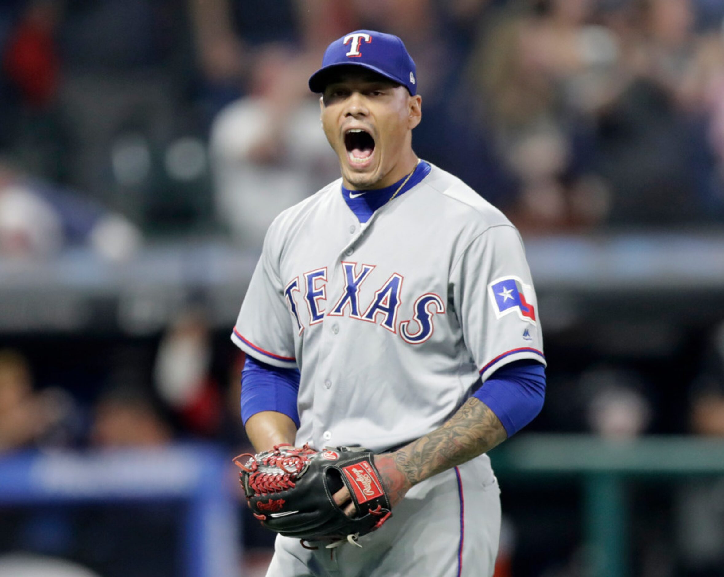 Texas Rangers relief pitcher Keone Kela reacts after giving up a grand slam to Cleveland...